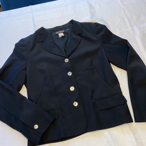 Black Blazer. French Connection tailored four button blazer. Lined. Size Medium.